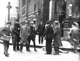 The body of Mary Miller, surrounded by investigators. "She waved to the crowd below... her body plummeted toward the street.". Photo courtesy of Cultural Ghosts.